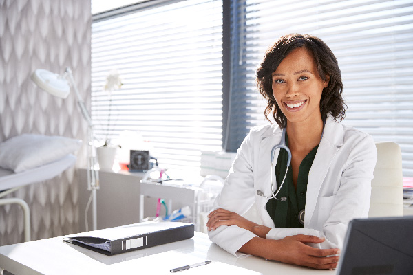 Female medical professional smiling for photo