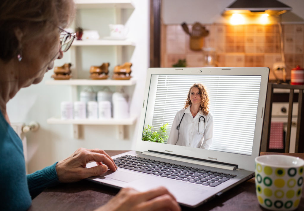 telemedicine concept elderly woman in an online consultation on