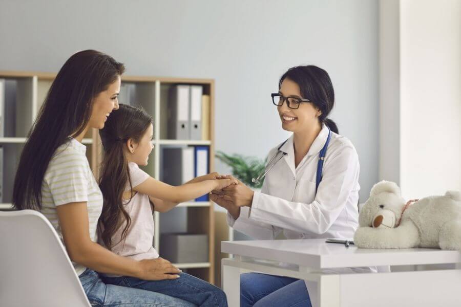 Doctor speaking with patients at a medical practice